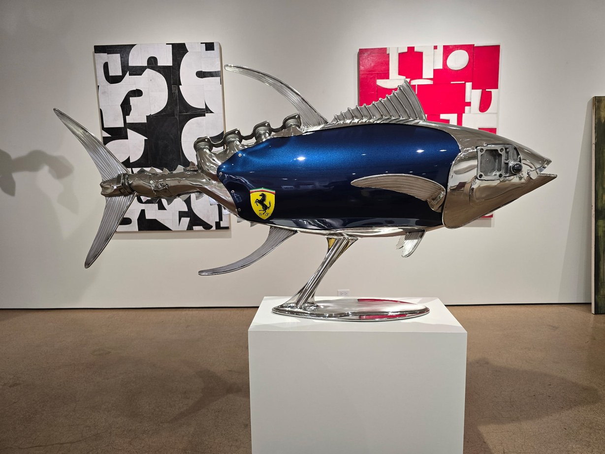 Tuna sculpture by James Ferrari with a deep blue metallic body panel and Ferrari shield badge