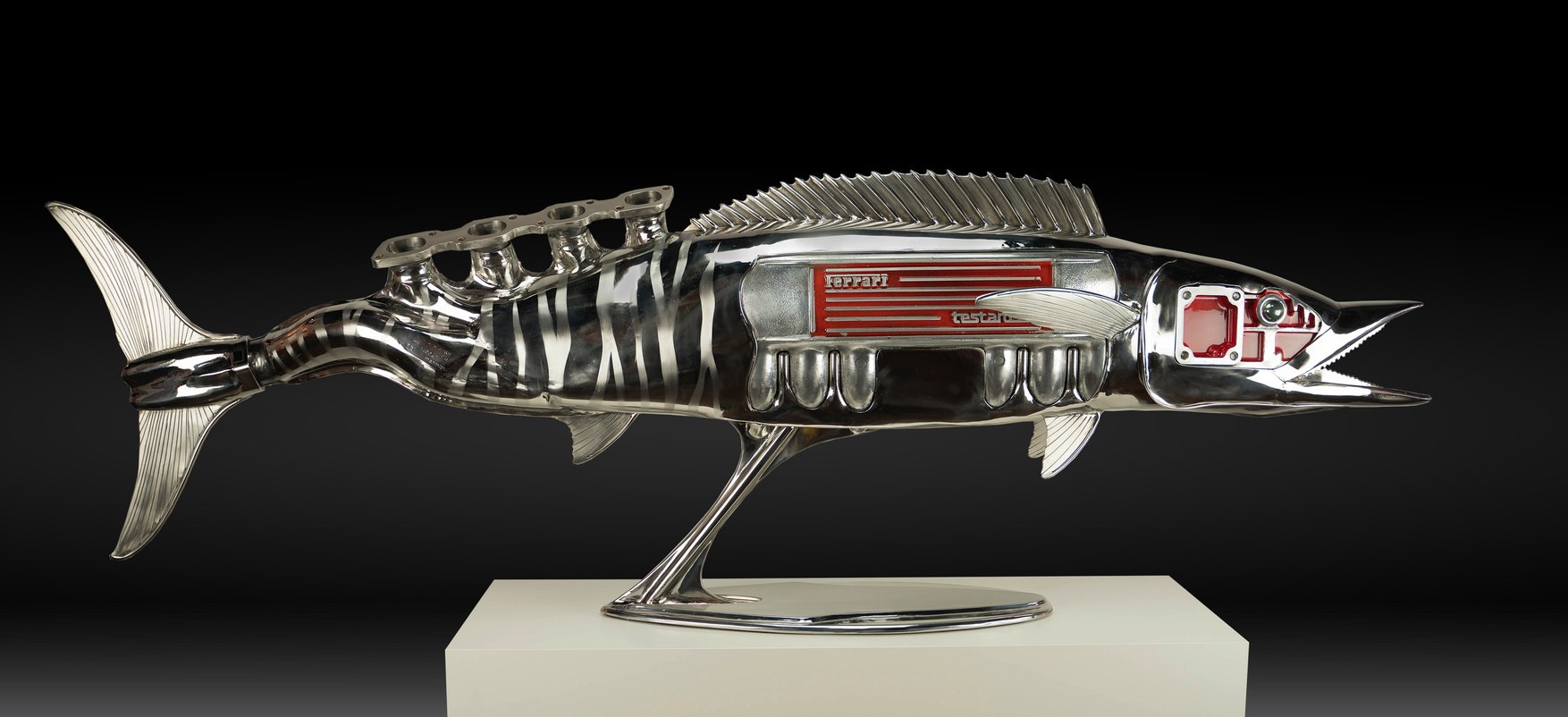 Wahoo, a chromed sculpture by James Ferrari with a Ferrari Testarossa badge